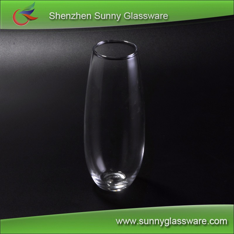 transparent tall drinking glass used for home goods