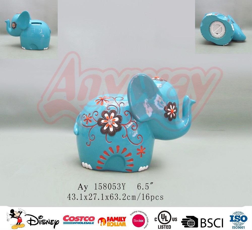 Hand painting blue elephant shape piggy bank