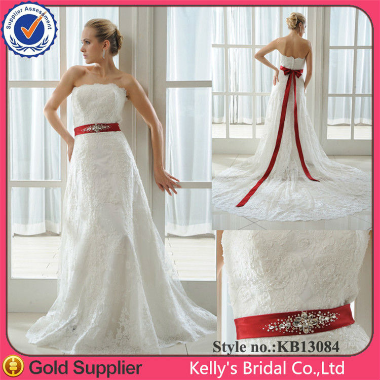 wedding dress with large red ribbon