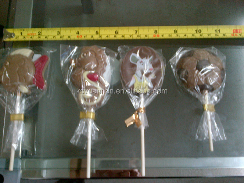 Chocolate bar on a stick wrapping machine