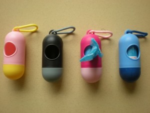 Pet-Products-2014-Pill-Shap-Dog-Poop-Bags-Rolls-Dispensers.jpg